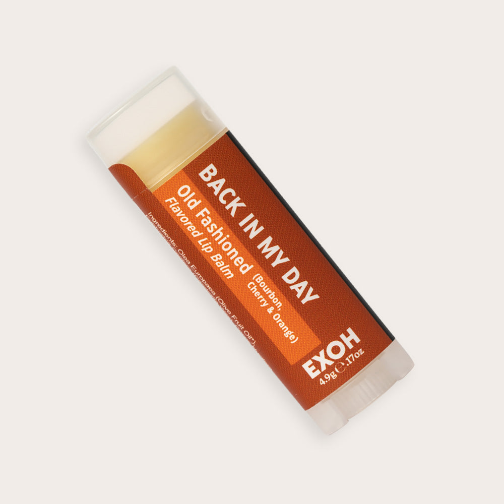 Product photo of old fashioned flavored lip balm "Back In My Day" by EXOH on grey background.