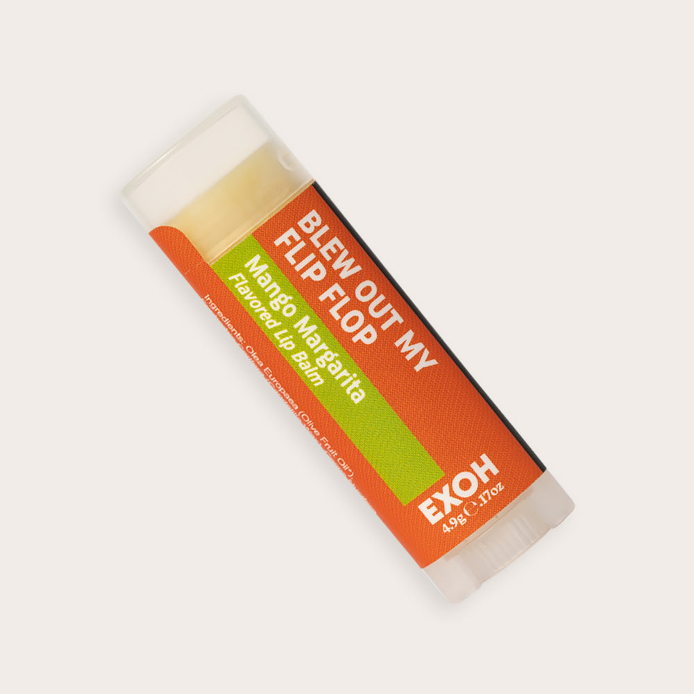 Product photo of mango margarita flavored lip balm "Blew Out My Flip Flop" by EXOH on grey background.