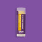 Product photo of blackberry lemonade flavored lip balm "F*uck The Lemons" by EXOH on bright purple background.