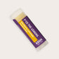 Product photo of blackberry lemonade flavored lip balm "F*uck The Lemons" by EXOH on grey background.