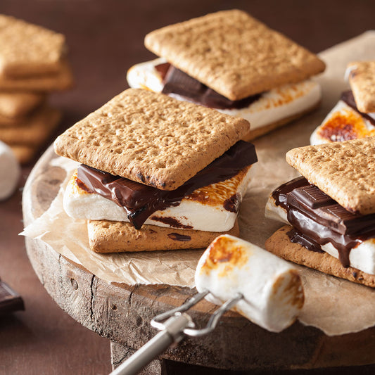S'mores cookies with toasted marshmallow and melted chocolate, indicating flavor of "I'd Rather Be Camping" flavored lip balm by EXOH.