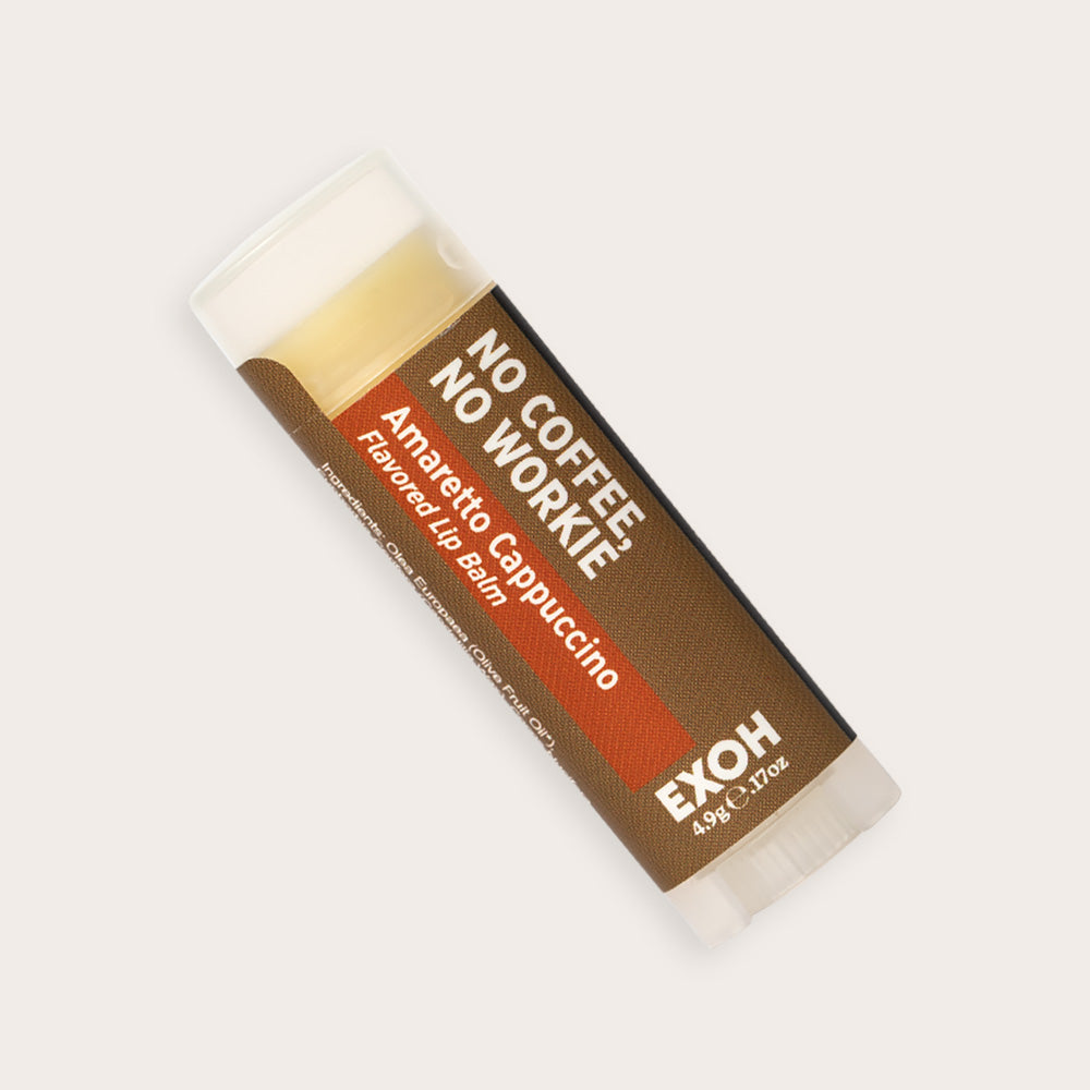 Product photo of amaretto cappuccino flavored lip balm "No Coffee, No Workie" by EXOH on grey background.