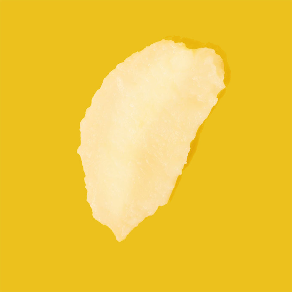 Swatch of EXOH flavored lip balm on a yellow background.